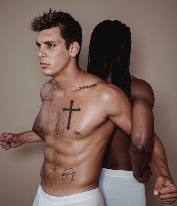 Man performing a focused strength exercise in a minimalist gym.